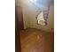 Bedroom featuring wooden floors, neutral walls, and an air conditioning unit in the window at 718 South Ave, Forest Park, GA 30297