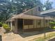 Quaint single-story home with a covered porch and neutral-tone exterior at 718 South Ave, Forest Park, GA 30297