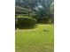 Spacious front yard featuring a shed and lush green lawn at 718 South Ave, Forest Park, GA 30297
