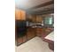 Functional kitchen with wooden cabinets and black oven at 718 South Ave, Forest Park, GA 30297