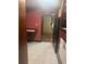Functional kitchen with wooden cabinets and black refrigerator at 718 South Ave, Forest Park, GA 30297