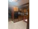 Functional kitchen with wooden cabinets and black oven at 718 South Ave, Forest Park, GA 30297