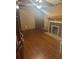 Living room featuring hardwood floors, a decorative fireplace, and neutral-toned walls at 718 South Ave, Forest Park, GA 30297
