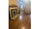 Living room featuring hardwood floors, a decorative fireplace, and neutral-toned walls at 718 South Ave, Forest Park, GA 30297