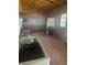 An interior storage shed featuring lattice windows, shelving, and a chest freezer at 718 South Ave, Forest Park, GA 30297