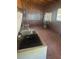 An interior storage shed featuring lattice windows, shelving, and a chest freezer at 718 South Ave, Forest Park, GA 30297