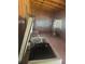 An interior storage shed featuring lattice windows, shelving, and a chest freezer at 718 South Ave, Forest Park, GA 30297