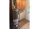 Utility room featuring a hot water heater and basic cabinets at 718 South Ave, Forest Park, GA 30297