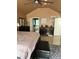 Well-lit bedroom boasting a large bed, modern decor, and an en-suite bathroom, creating a serene retreat at 751 Stonecreek Way, Stone Mountain, GA 30087