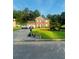 Beautifully landscaped two-story brick home with a well-manicured lawn and inviting curb appeal at 751 Stonecreek Way, Stone Mountain, GA 30087