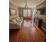 Inviting living room with hardwood floors, a decorative fireplace, and neutral tones at 751 Stonecreek Way, Stone Mountain, GA 30087