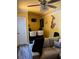 A modern living room featuring a stylish ceiling fan, a bar area and unique decorative elements at 751 Stonecreek Way, Stone Mountain, GA 30087
