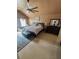 Comfortable main bedroom with decorative walls, king size bed, and a large dresser with mirror at 751 Stonecreek Way, Stone Mountain, GA 30087