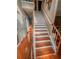 Elegant staircase with wooden treads and white risers, complemented by a classic wooden banister at 751 Stonecreek Way, Stone Mountain, GA 30087