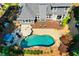 Aerial shot showcasing a well kept yard, deck and a beautiful pool at 830 Club Chase Ct, Roswell, GA 30076
