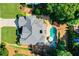Backyard aerial featuring in ground pool, deck, patio and mature landscaping at 830 Club Chase Ct, Roswell, GA 30076