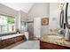 This stylish bathroom has a separate tub, a glass shower, granite countertops, and double sinks at 830 Club Chase Ct, Roswell, GA 30076