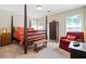 This warm bedroom has a four poster bed, a sitting chair, and two windows at 830 Club Chase Ct, Roswell, GA 30076