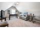 This finished bonus room has a couch, a foosball table, and space to hang out at 830 Club Chase Ct, Roswell, GA 30076