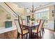 Dining room with tile and wood floors, and stairs in view at 830 Club Chase Ct, Roswell, GA 30076