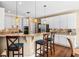 Spacious kitchen features granite countertops, stainless steel appliances and breakfast bar seating at 830 Club Chase Ct, Roswell, GA 30076