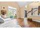 Bright living room featuring hardwood floors, a large window, and neutral-toned walls at 830 Club Chase Ct, Roswell, GA 30076