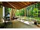 Scenic backyard space with wooden stairs, mature trees, and peaceful surroundings at 85 Eastwood Frst, Covington, GA 30014
