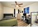 Cozy bedroom featuring modern decor, a ceiling fan, and great natural light at 85 Eastwood Frst, Covington, GA 30014
