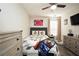 Charming bedroom with a queen bed, dresser, and stylish decor at 85 Eastwood Frst, Covington, GA 30014