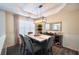 Elegant dining room with modern light fixture, stylish decor, and comfortable seating at 85 Eastwood Frst, Covington, GA 30014