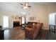 Cozy living room with a fireplace, vaulted ceiling, and comfortable seating arrangement at 85 Eastwood Frst, Covington, GA 30014