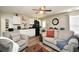 Open living area with a partial kitchen, hardwood floors, and comfortable furnishings at 85 Eastwood Frst, Covington, GA 30014