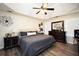 Serene main bedroom with tray ceiling, neutral tones, and ample natural light at 85 Eastwood Frst, Covington, GA 30014