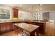 Bright kitchen featuring an island, granite countertops, and stainless steel dishwasher at 10565 Highgate Manor Ct, Duluth, GA 30097