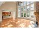 Bright living room with stone fireplace, high ceilings and open access to the gourmet kitchen and breakfast nook at 10565 Highgate Manor Ct, Duluth, GA 30097