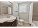 Cozy bathroom featuring a stylish vanity and tiled shower/bath, offering comfort and convenience at 2432 Saint Patrick Se St, Atlanta, GA 30317