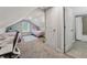 Bright bedroom with two twin beds and desk and adjacent bathroom at 2432 Saint Patrick Se St, Atlanta, GA 30317