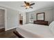 The bedroom features hardwood floors and neutral paint, with an ensuite bathroom visible in the background at 2432 Saint Patrick Se St, Atlanta, GA 30317
