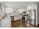 Modern kitchen featuring white cabinets, stainless steel appliances, and granite countertops at 2432 Saint Patrick Se St, Atlanta, GA 30317