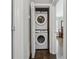 A laundry closet with stacked washer and dryer at 2432 Saint Patrick Se St, Atlanta, GA 30317