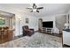 Open-concept living room with hardwood floors, comfortable seating, and plenty of natural light at 2432 Saint Patrick Se St, Atlanta, GA 30317