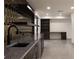 Wet bar with decorative tile and shelving next to office space at 1155 Peachtree Battle Nw Ave, Atlanta, GA 30327