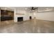 Open basement space with fireplace and adjacent bar area at 1155 Peachtree Battle Nw Ave, Atlanta, GA 30327