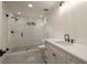 Modern bathroom with white marble walk-in shower and black fixtures at 1155 Peachtree Battle Nw Ave, Atlanta, GA 30327