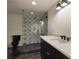 Bathroom with black fixtures and decorative shower tile at 1155 Peachtree Battle Nw Ave, Atlanta, GA 30327