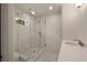 Bathroom with a glass walk-in shower, tile floor, and a modern sink at 1155 Peachtree Battle Nw Ave, Atlanta, GA 30327
