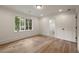 Bright bedroom with hardwood floors, large window, and ensuite bathroom at 1155 Peachtree Battle Nw Ave, Atlanta, GA 30327
