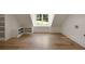 Bonus room with hardwood flooring, natural light, and built in shelves providing ample storage at 1155 Peachtree Battle Nw Ave, Atlanta, GA 30327