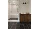 Luxurious main bathroom featuring a glass enclosed shower and wooden vanity cabinet at 1155 Peachtree Battle Nw Ave, Atlanta, GA 30327