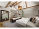 Bright main bedroom featuring a king bed, and beverage center leading to a private balcony at 1155 Peachtree Battle Nw Ave, Atlanta, GA 30327
